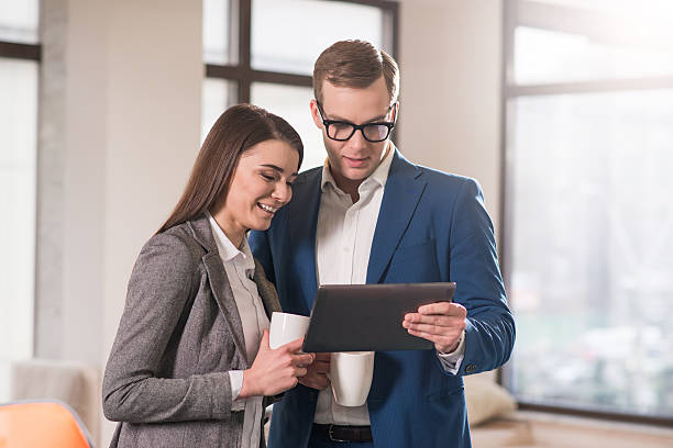 istock Positive colleagues drinking coffee in the office 523253954