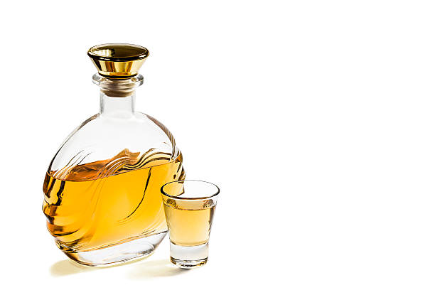 istock Bottle and shot glass tequila on white background 523254932