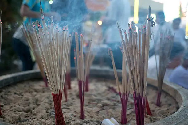 Photo of Blur burning incense and candle  for backgroud,abstract