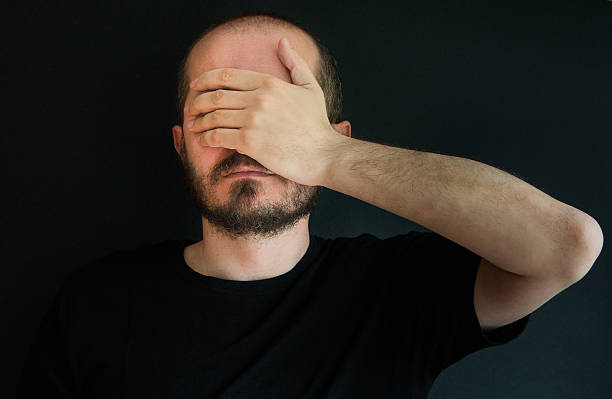 istock Man on black background, face palm gesture 523255908
