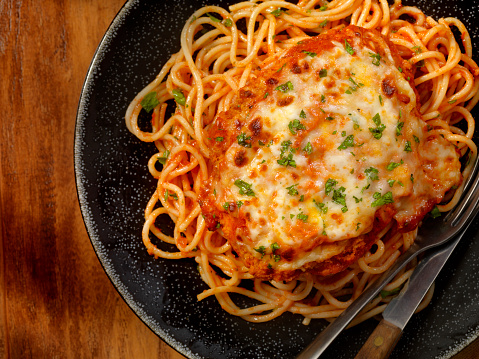 Chicken Parmesan Baked in Tomato Sauce with Spaghetti and Mozzarella Cheese- Photographed on a Hasselblad H3D11-39 megapixel Camera System