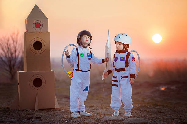 Two adorable children, playing in park on sunset