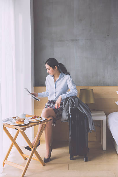 istock asian businesswoman reading newspaper 523258537
