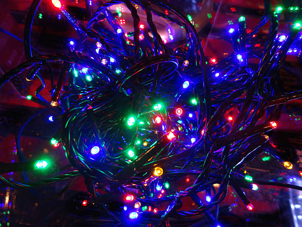 istock Tangled multi-coloured Christmas tree fairy lights, twinkling xmas lights image 523259055