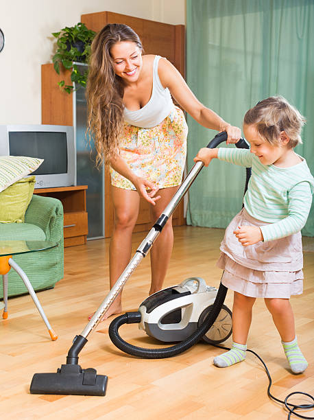 istock Family with vacuum cleaner 523259821
