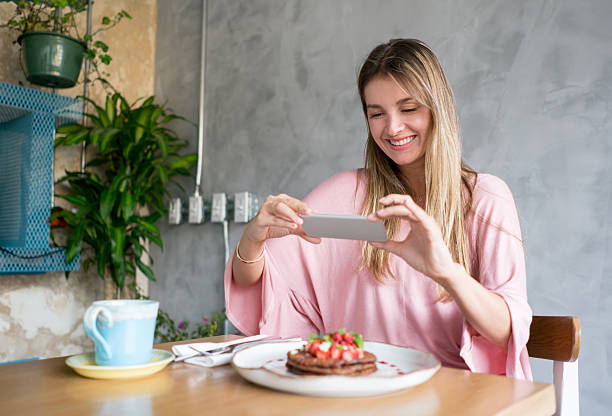istock Woman using food app at a restaurant 523260296
