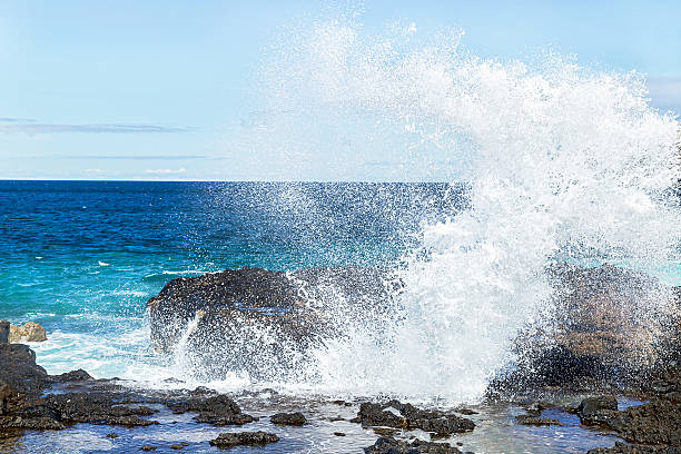 istock Big blue ocean waves breaking on the shore with foam. 523261252