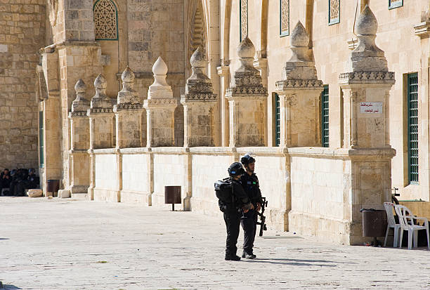 Al-aqsa mosque Jerusalem, Israel -October 08, 2014: Israeli military security police on the eastern part of the Al-aqsa mosque on the temple-square in Jerusalem during fightings with muslims riot tear gas stock pictures, royalty-free photos & images