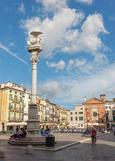 Padua, Italy - September 10, 2014: Piazza dei Signori square  and st. Mark column with the church of San Clemente in the background and lot of peoples.