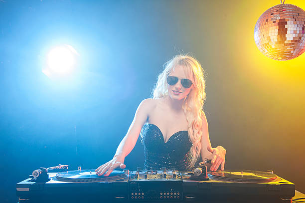 istock Female DJ playing music 523263768