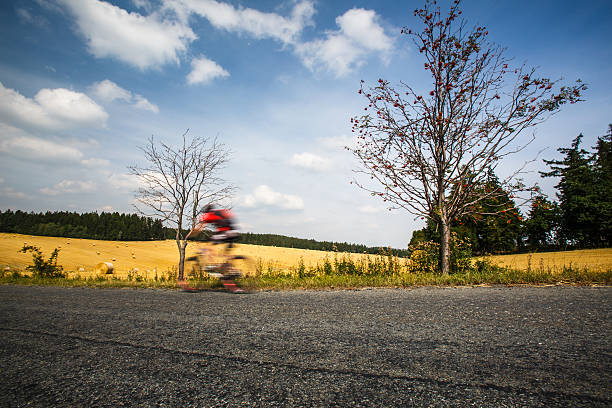 istock Motion blurred biker on a mountain road 523264498