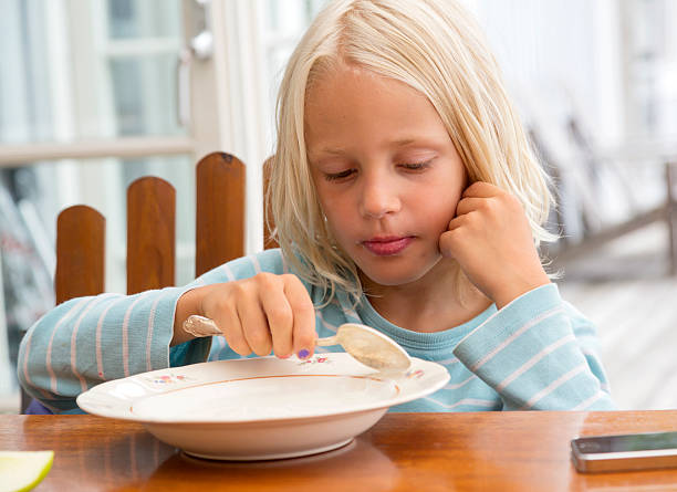 istock Young blond boy eating yogurt. 523264545