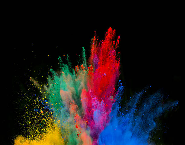 istock Explosion of colored powder on black background 523264638