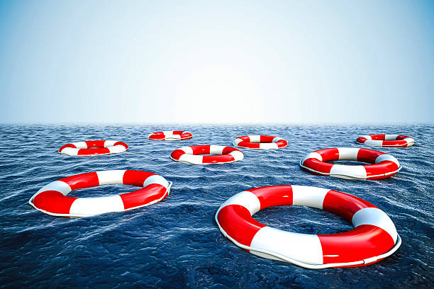 istock 3d life buoy and ocean with blue sky background 523265447