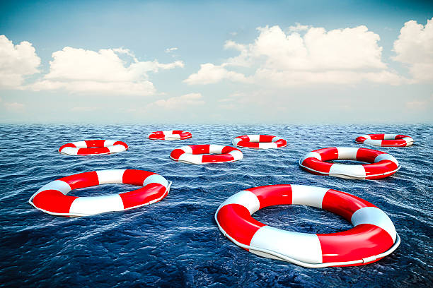 istock 3d life buoy and ocean with blue sky background 523265449