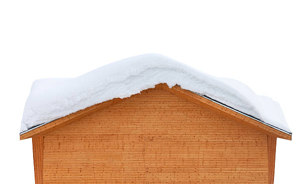 istock Wooden house with snow on roof 523265864