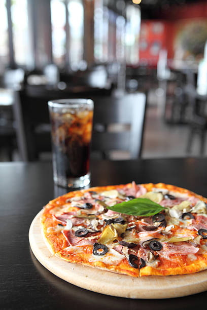 Pizza with dry cured ham and basil