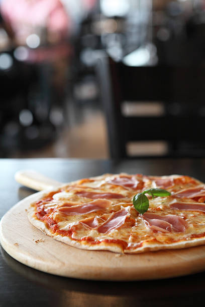 istock Pizza with dry cured ham and basil 523272359