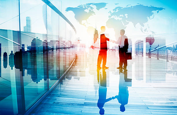 istock Silhouettes of Two Businessman Shaking Hands 523273657