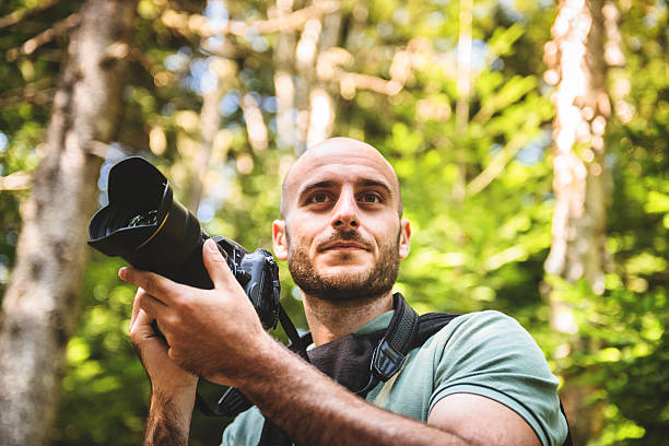 istock photographer on the woods 523274059