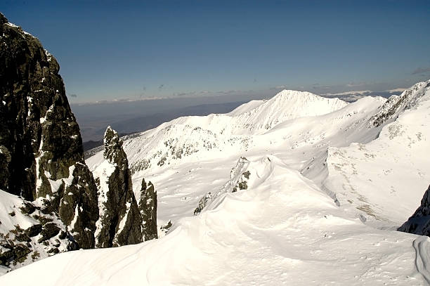 istock Snow covered mountains in a sunny day 523275395