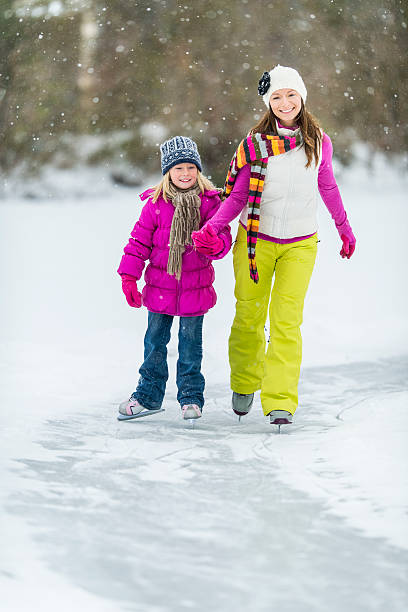istock Family Ice-Skating on Pond 523275987