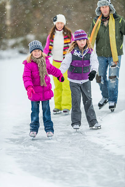 istock Family Ice-Skating on Pond 523277183