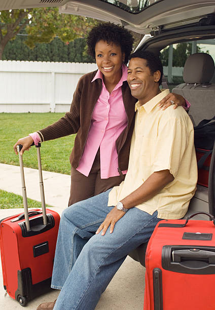 istock Couple and Luggage Standing by Minivan 523278203