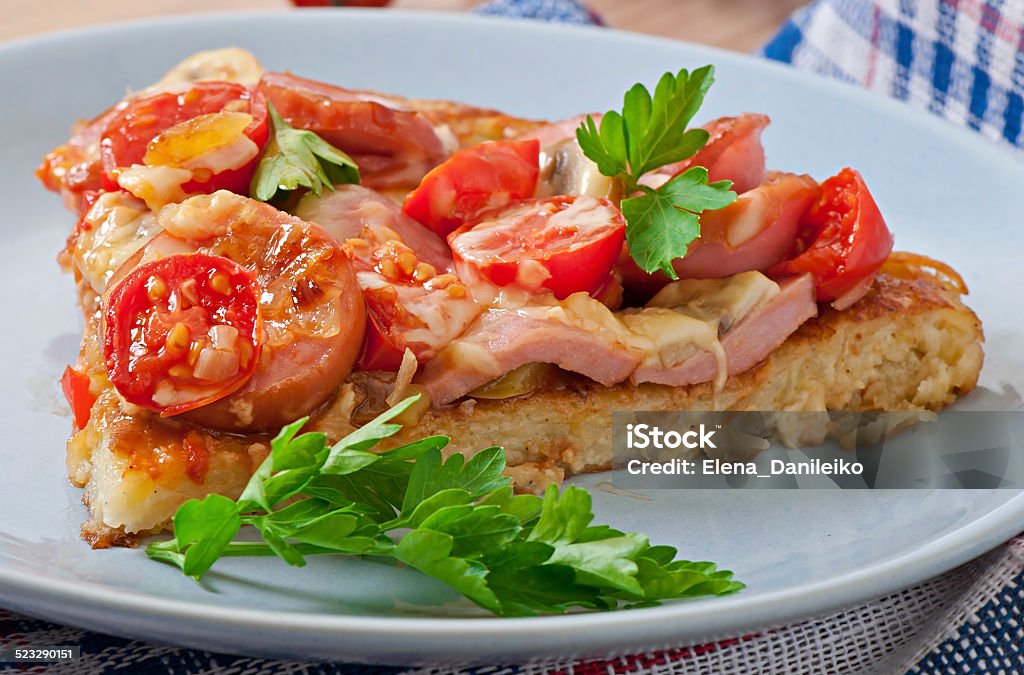 Potato gratin - pizza with sausage, mushrooms and tomatoes Appetizer Stock Photo