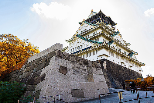 Osaka, Japan - October 23, 2014:: Osaka Castle is the most famous castle in Japan. It is located in Chuo-ku, Osaka, Japan. The castle is open to the public and it is a main tourist attraction in Osaka, Japan. Some people are at the observation deck in Osaka Castle