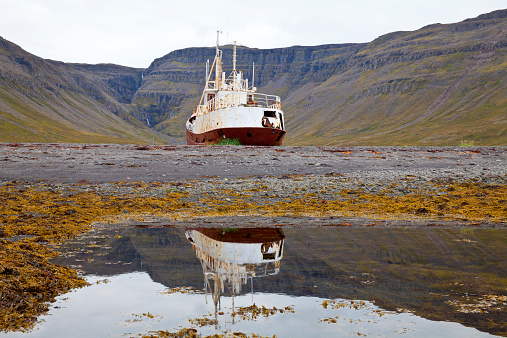 Wreck of a steel fishing boat in the west fjords, Iceland