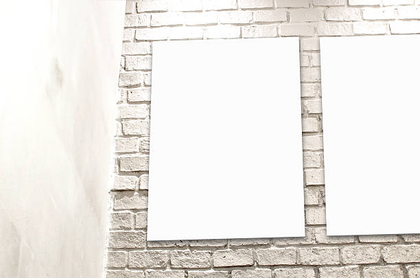 istock Blank Poster paper standing next to a white brick wall 523290771