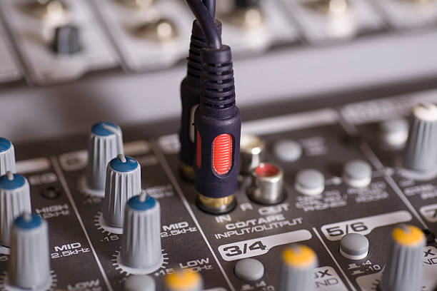 istock Mixing console with wires plugged in 523291513