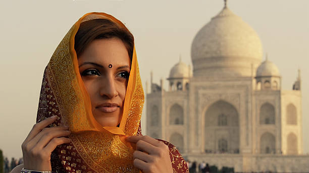 istock Indian woman at Taj Mahal 523293285