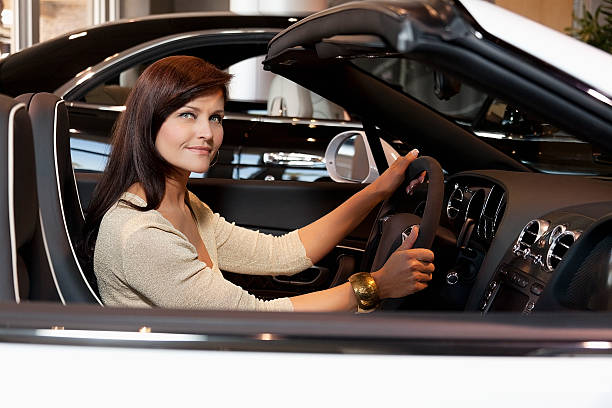 istock Happy people in a Car showroom 523293623