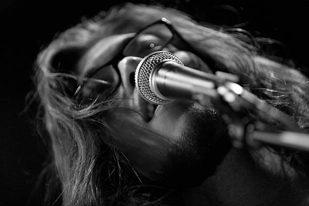 istock seventies style singer performing live on stage 523312573