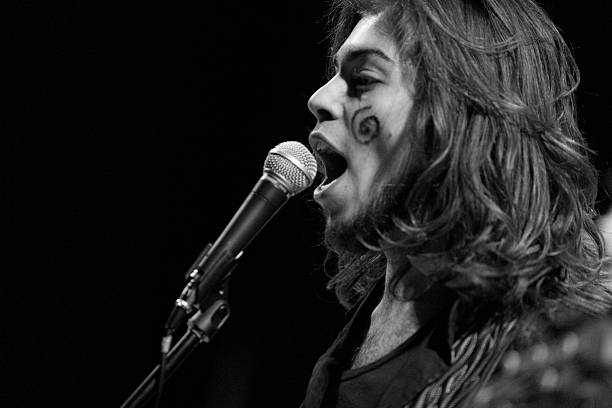 istock Long hair singer performing live on stage 523312645