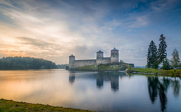 Olavinlinna fortress Olavinlinna fortress at sunrise. Early morning in Savonlinna, Finland. etela savo finland stock pictures, royalty-free photos & images