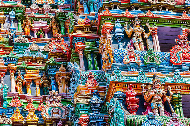 Sculptures on Hindu temple gopura tower. Meenakshi Temple, Madurai, Tamil Nadu, India