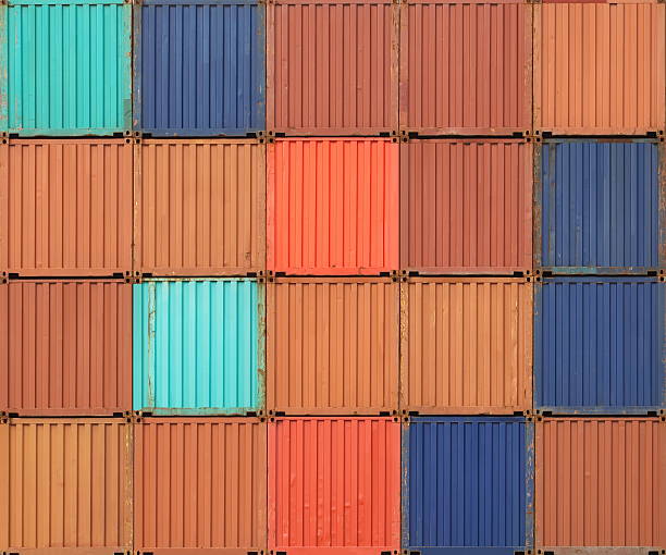 istock Stacked cargo containers in freight sea port terminal 523316297