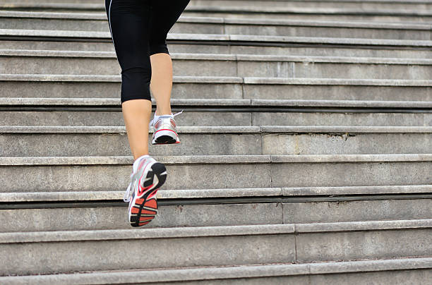 istock Runner athlete running on city stairs. 523316591