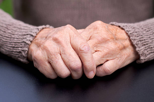 Wrinkled hands Picture of a wrinkled elderly hand arthritis stock pictures, royalty-free photos & images