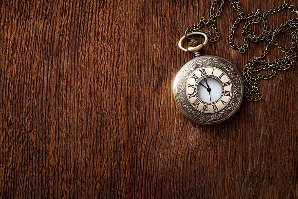 istock Vintage pocket watches on dark oak texture background 523355589