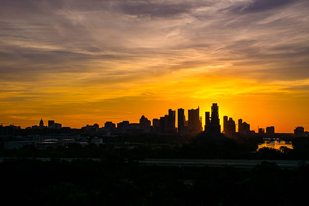 istock Austin Silhouette Skyline Sun Beams Cut in Half Austonian 523355639
