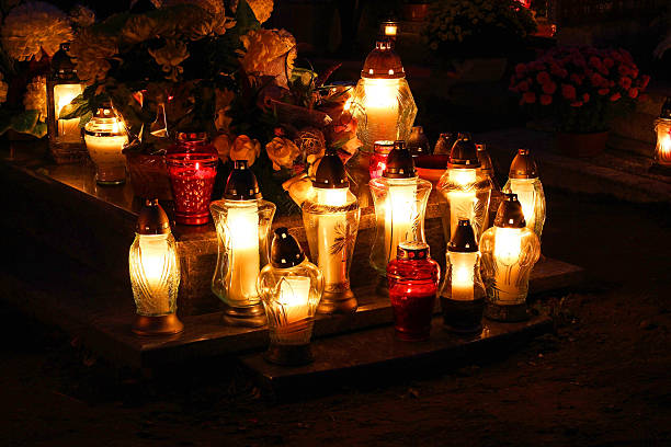 istock Candles to the cemetery at night 523356393