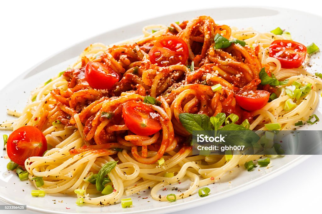 Pasta with meat, tomato sauce and parmesan Pasta with meat and vegetables Basil Stock Photo