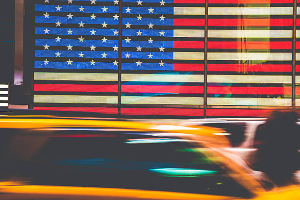 istock Yellow cab in front of American Flag 523356485