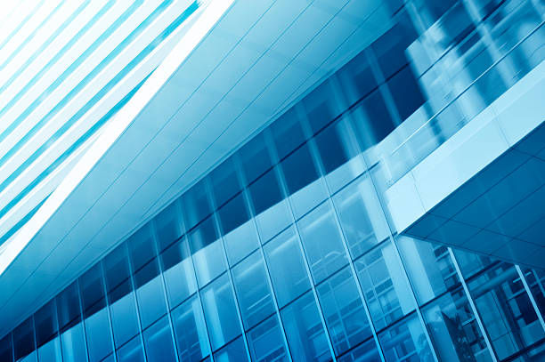 istock Light blue background of glass high rise building 523356623