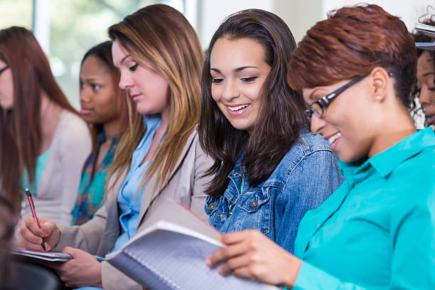 istock Diverse group of women taking notes during seminar 523357015