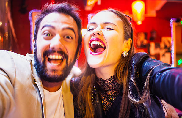 istock Young couple in love taking selfie 523359343